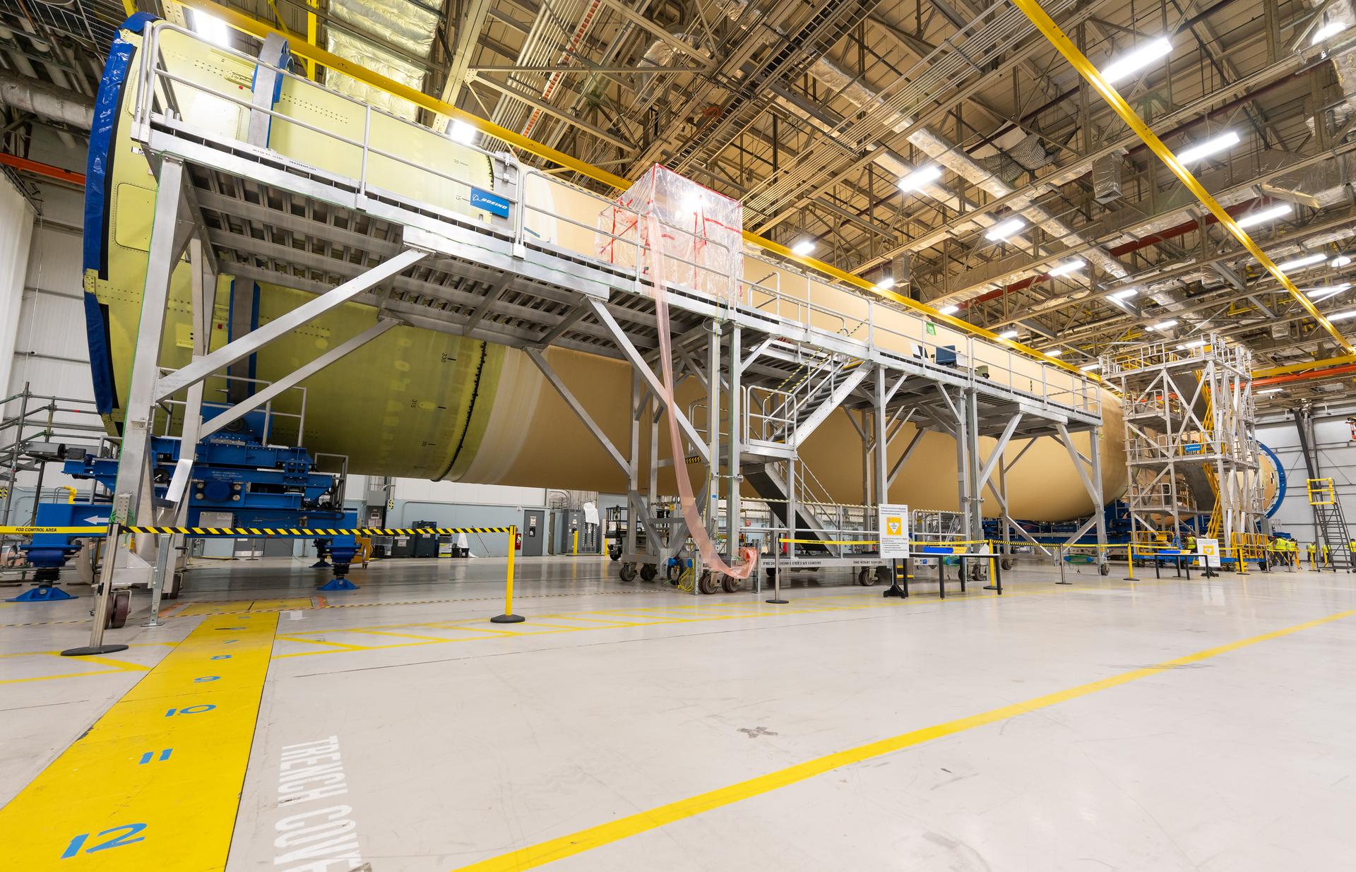 Move crews at NASA’s Michoud Assembly Facility in New Orleans, lift the forward-joined flight hardware for the agency’s SLS (Space Launch System) rocket out of a stacking cell in the vertical assembly building on Dec. 19, 2025. The forward join, which consists of the intertank, liquid oxygen tank, and forward skirt, will be used on the core stage slated for NASA’s Artemis III mission. Teams moved the flight hardware from the cell and set it atop self-propelled mobile transporters. The article was brought to the factory’s final assembly area on Dec. 27, 2025 where it will be mated to the core stage’s previously joined liquid hydrogen tank and undergo further integration.    The core stage, along with its four RS-25 engines, produce more than two million pounds of thrust to help launch NASA’s Orion spacecraft, astronauts, and supplies beyond Earth’s orbit and to the lunar surface for Artemis.